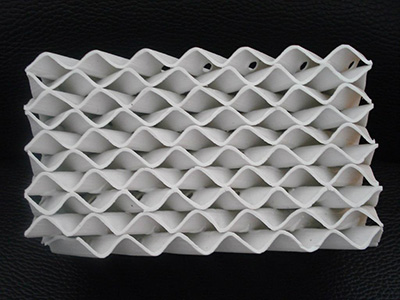 Ceramic Packing for Toluenediamine Processing Systems